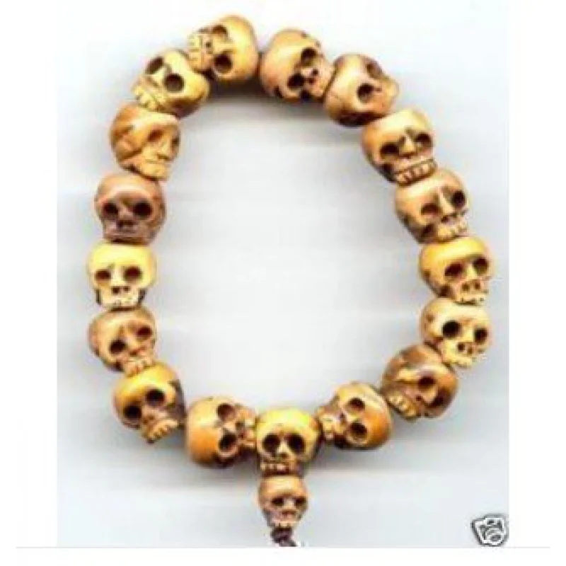 

Браслет из тибетских бусин с вырезанными черепами