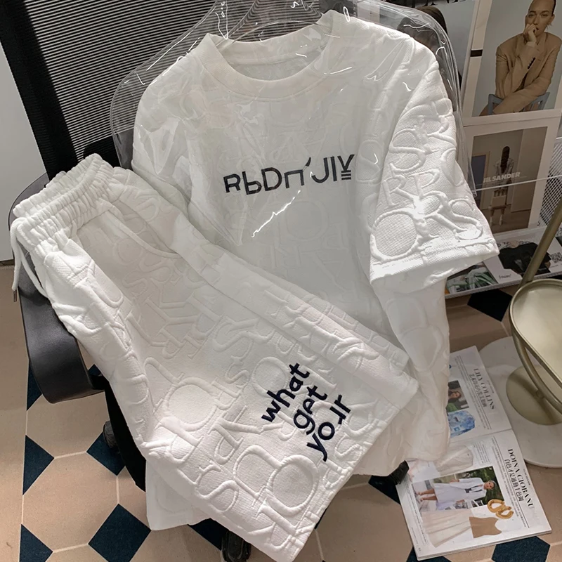 

Two Piece Set For WomenCasual Sportswear Ensemble Femme 2 PièCes éTé 2023 New Loose Embossed Short Sleeve T-Shirts+Wide Leg Shor