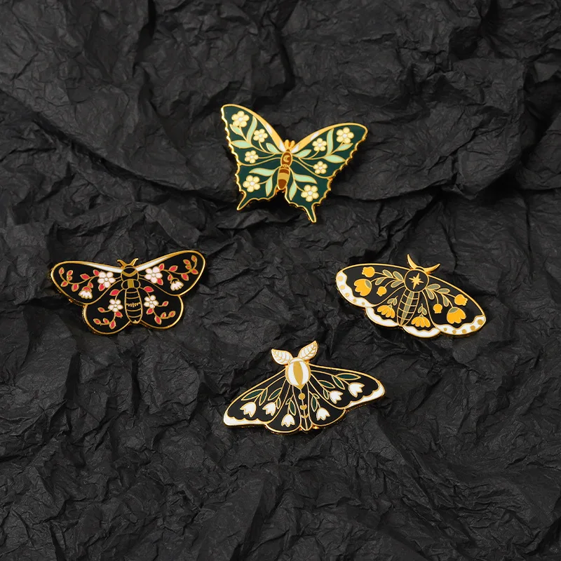 

Butterflys Moth Hard Enamel Pins Custom Lily of the Valley Vine Brooches Lapel Badge Black Insect Plant Jewelry Gift for Friends