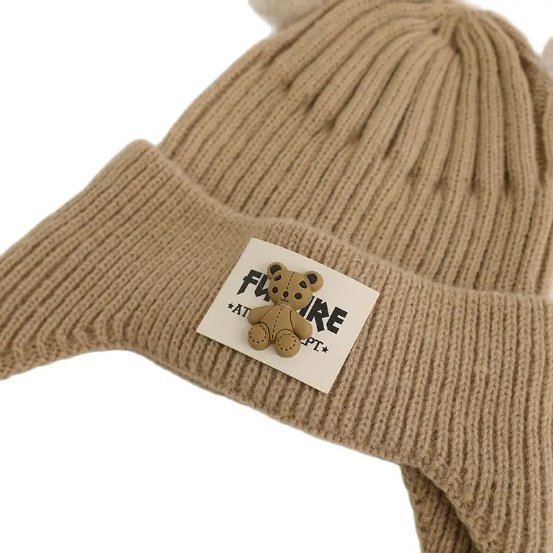 Рисунок 6 - Зимние детские вязаные шапки с