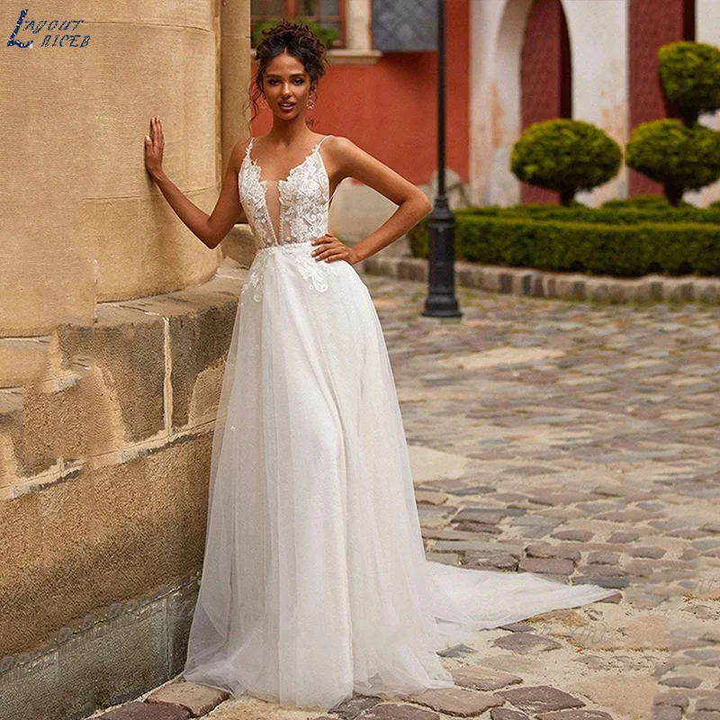 

Vintage Wedding Dresses Spaghetti Straps Lace Appliques Soft Tulle Sweep Train Robe De Mariée Backless Bridal Gowns Bride Party