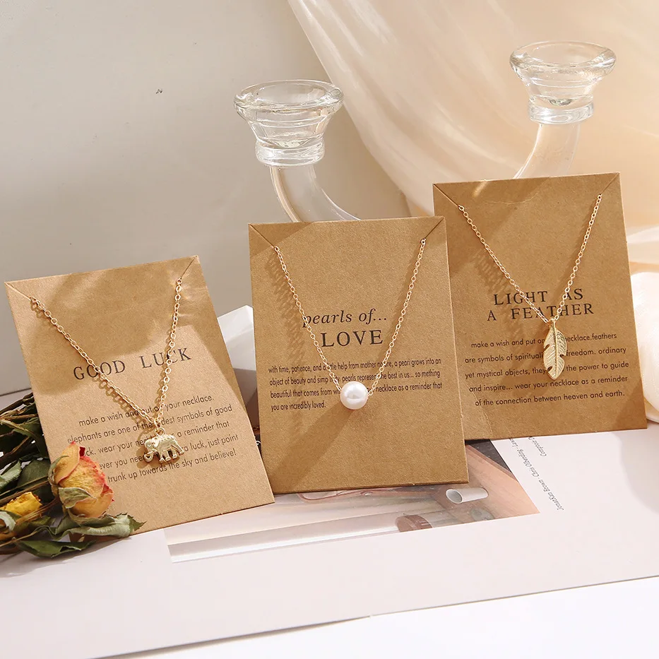 

Cute Creative Pearl Feather Collarbone Chain Retro Alphabet Paper Card Butterfly Elephant Cat Alloy Necklace Wholesale