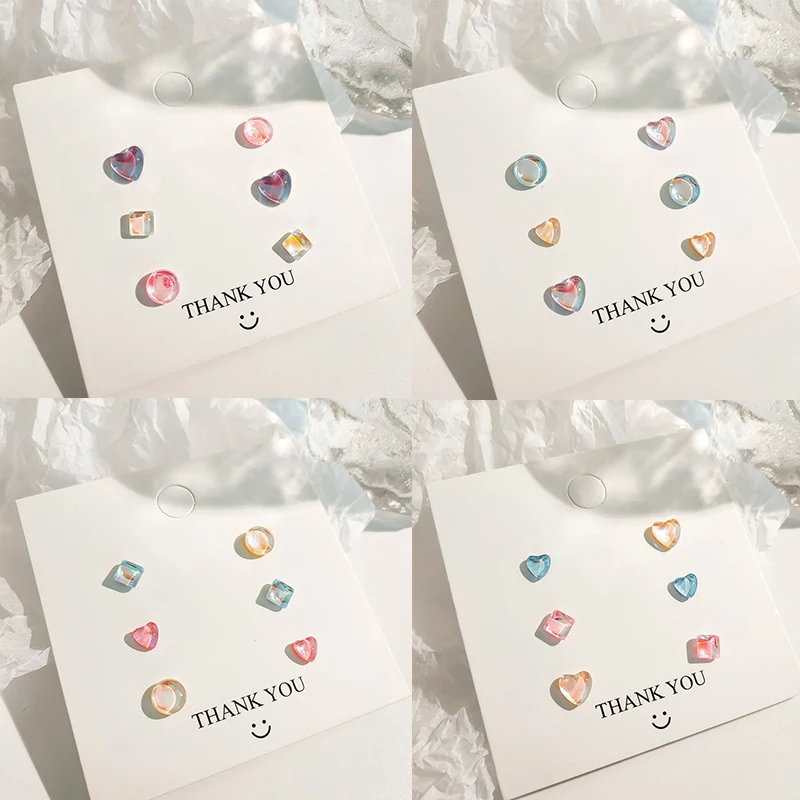 Набор разноцветных прозрачных круглых сережек-гвоздиков в форме сердца KADRUFI