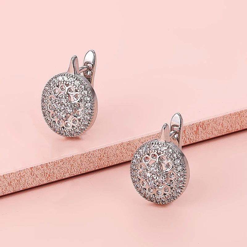 

Simple Fashion Exquisitely Zircon Hollow Stud Earrings For Women Metal Charm Wedding Jewelry Gold Silver Color Flower Earrings