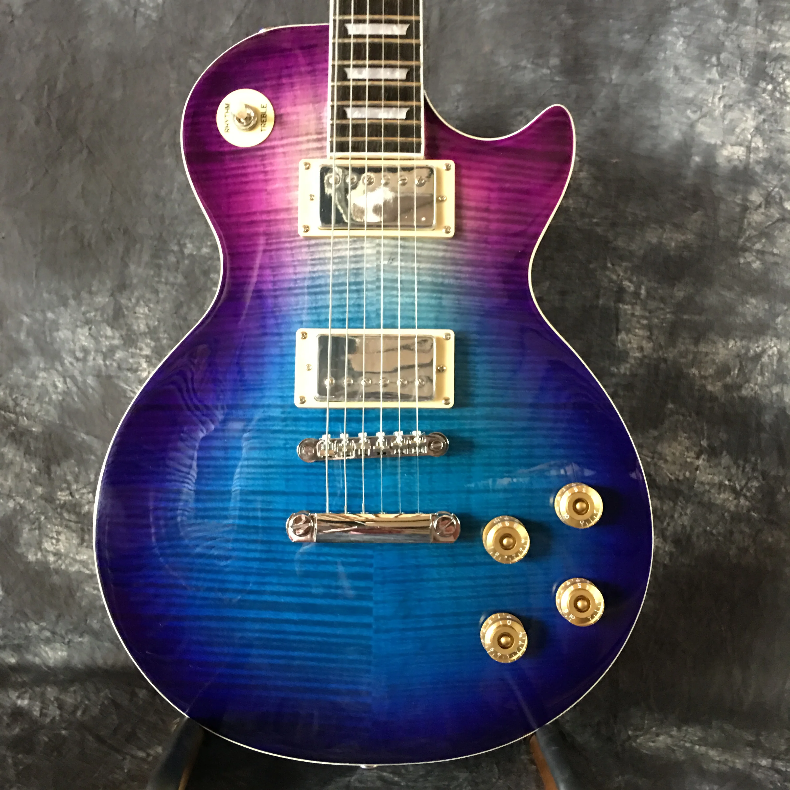 

Flamed maple top blue six string LP electric guitar, with fret binding our store supports customization guitar