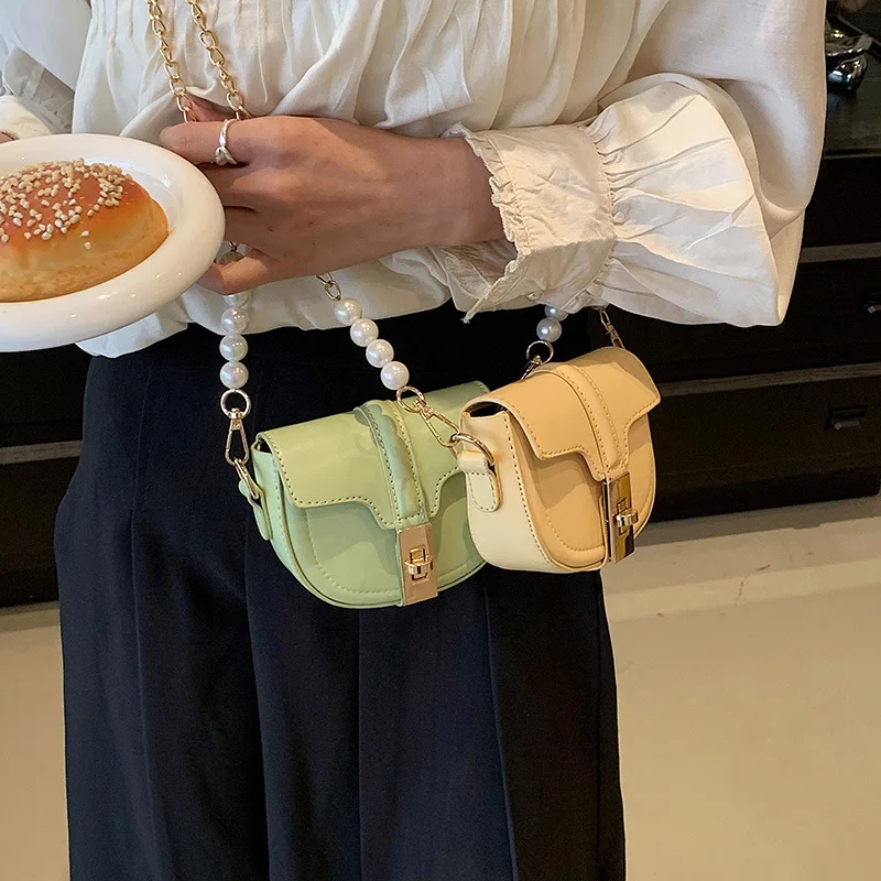 

Korean Version Ins New Twist Lock Girls' Chain Mini Saddle Bag Fashionable And Simple Pearl Children'S Crossbody Small Bag