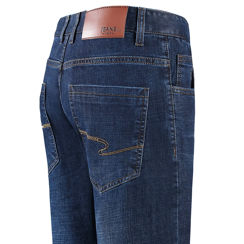 

Мужские джинсовые брюки стрейч с карманами и вышивкой