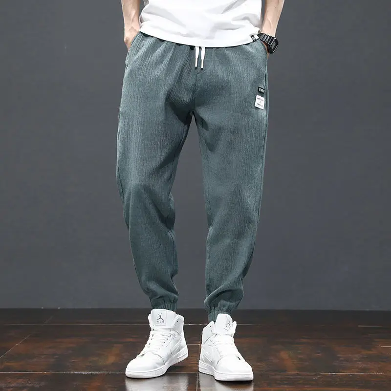 2023 Men's Summer New Stretch Breathable Loose Sport Versatile Fashion Casual Solid Color Elastic Waist Spliced Pocket Trousers