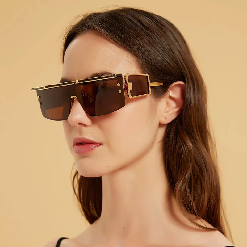 

Солнцезащитные очки унисекс в золотистой металлической оправе