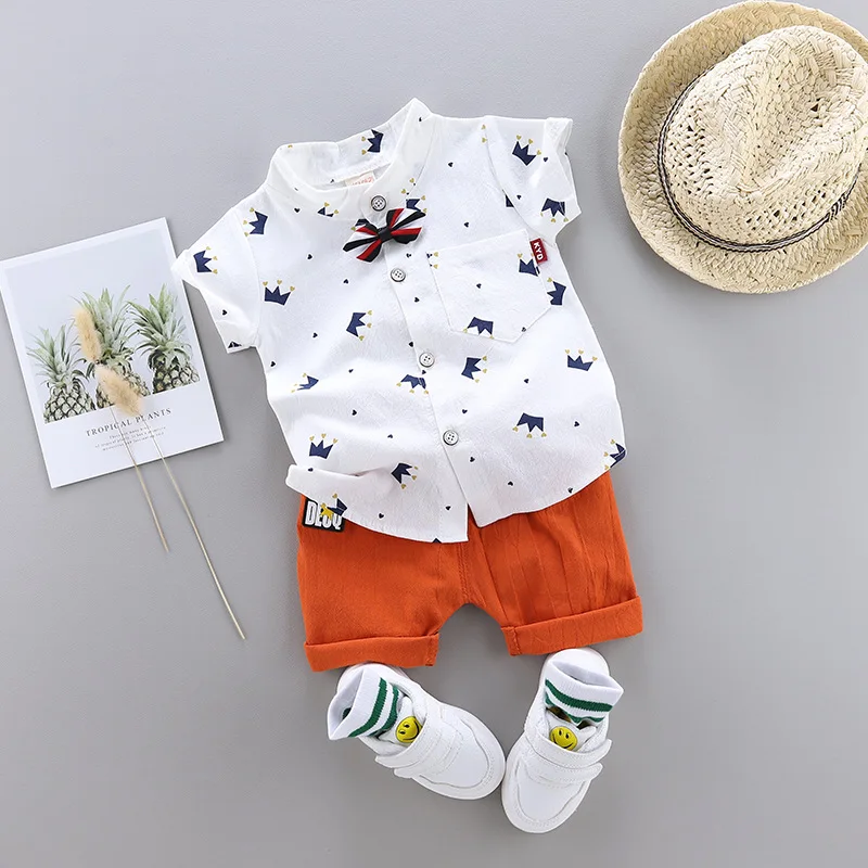 

2pcs Korean Boy Boutique Outfit Summer White T Shirt Shorts Suit Fashion Crown Printed Bow Tie Baby Toddler Clothing Sets 0-3T