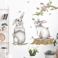 two cute playing bunny on the tree stump wall stickers with birds branches baby nursery room decals decorative stickers