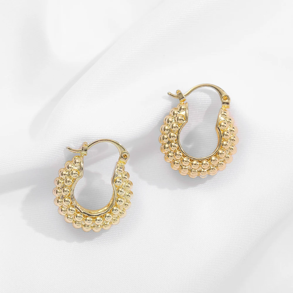 Женские объемные серьги-кольца круглые текстурированные обручи золотого цвета в