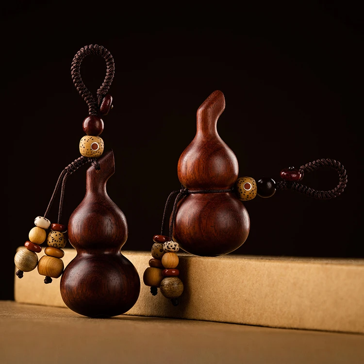 

Red sandalwood gourd inlaid with silver Benmingfo safe black sandalwood car key chain fallout