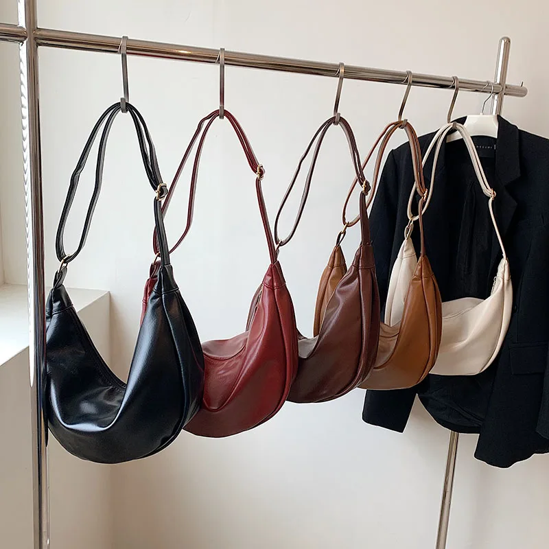 

High-grade texture crossbody bag Fashion niche zipper design PU material dumpling shape cute all-matching Korean large capacity