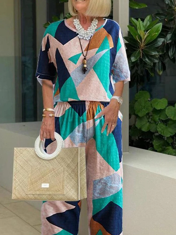

Women Geometry Printed Loose 2pc Sets Casual O-Neck Pullovers Tops And Long Pants Outfits 2022 Summer Fashion Short Sleeve Suits