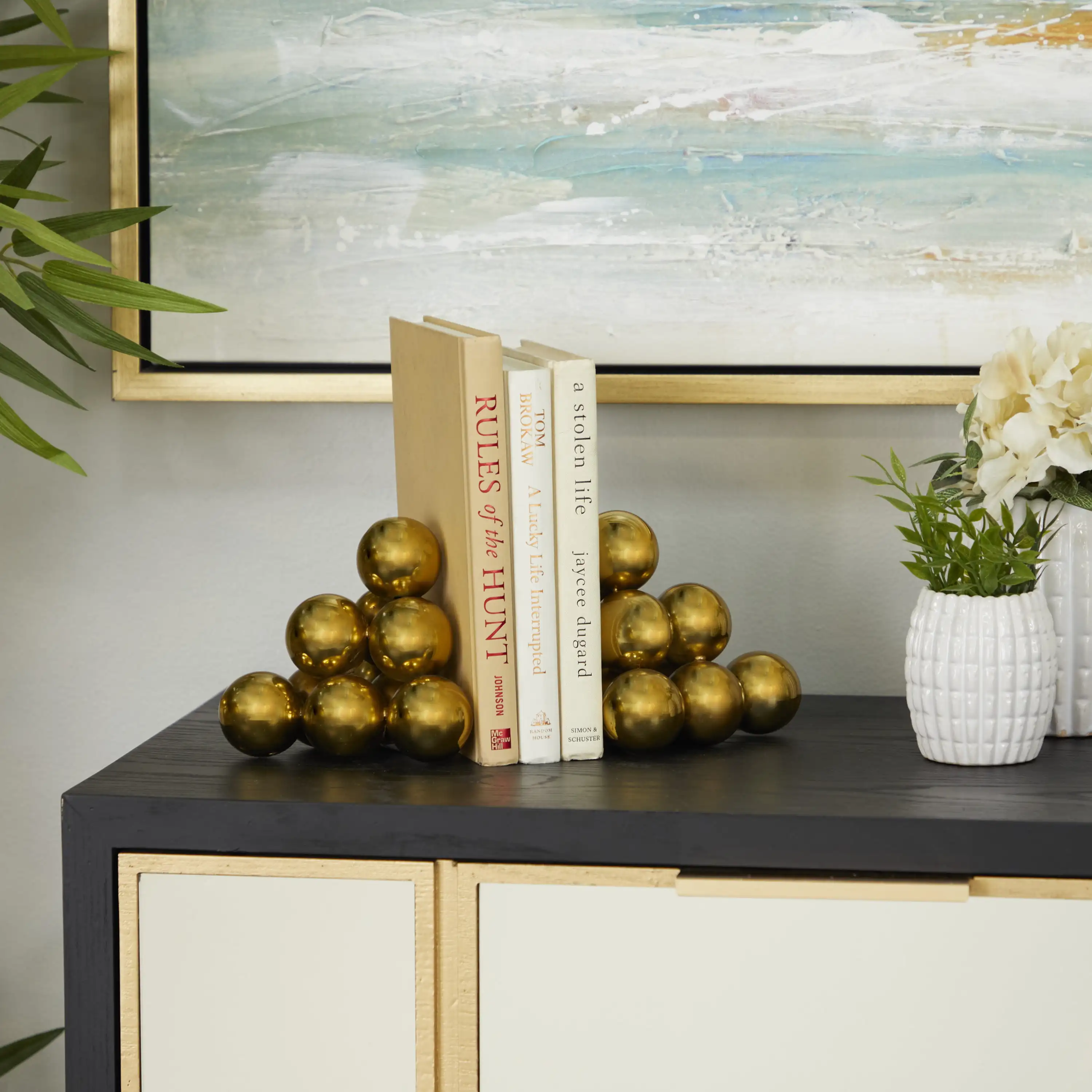 

Stainless Steel Modern Bookend Pairs with Triangular Arranged Orbs 6"W x 5"H, Features a Metallic Gold Finish