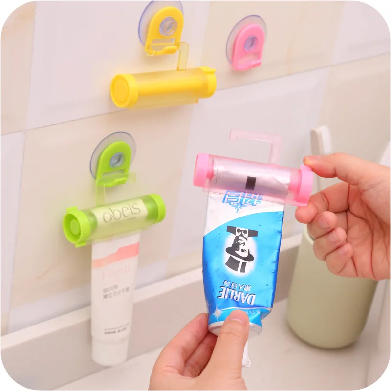 

New 1PCS Creative Rolling Squeezer Toothpaste Dispenser Tube Partner Sucker Hanging Holde Distributeur Dentifrice 5 Colors