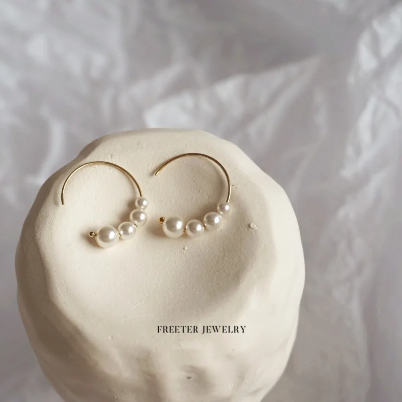 

Pearl earrings temperament simple hollow ring earrings