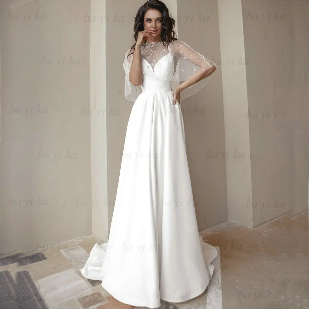 

Modern New Spaghetti Straps Beach Wedding Dress Robe De Mariée Backless A-Line Sexy Satin Pearls Princess Sleeveless Bridal Gown