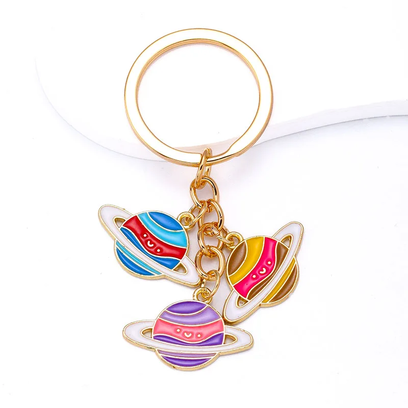 

2023 Trendy Alloy Enamel Colorful Planet Charms Key Chains Women Men Earphone Box Handbag Car Key Keyrings Pendant Decorations