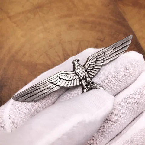 Металлическая брошь орел