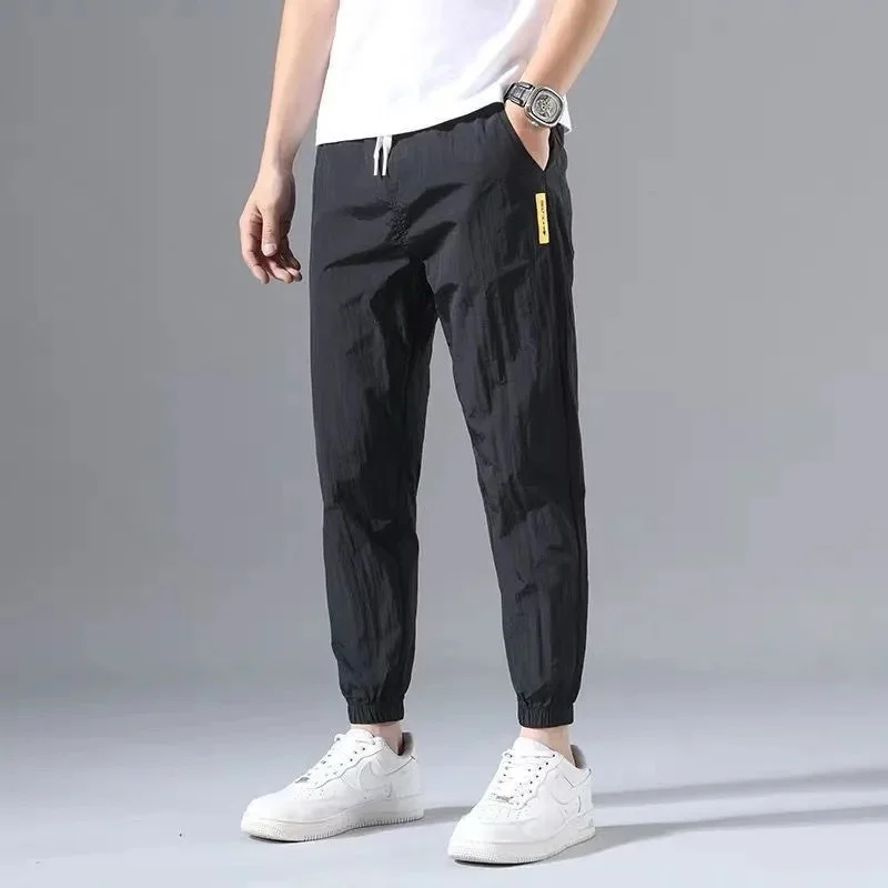 

Ice Silk Pants Men's Summer Thin Section Trend Wild Loose Casual Pants Sports Pants Quick-drying Harlan Nine-point Pants 2022