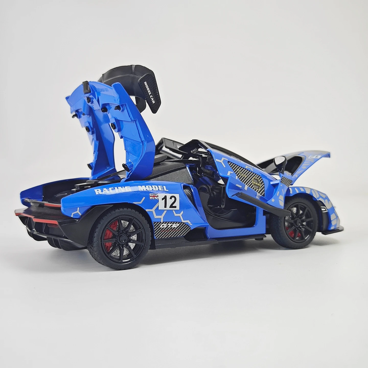 Фото Масштабная модель автомобиля McLaren Senna 1:24, окрашенная, из сплава, с открывающимися дверями, звуковыми и световыми эффектами, подарок для любителей суперкаров. №3