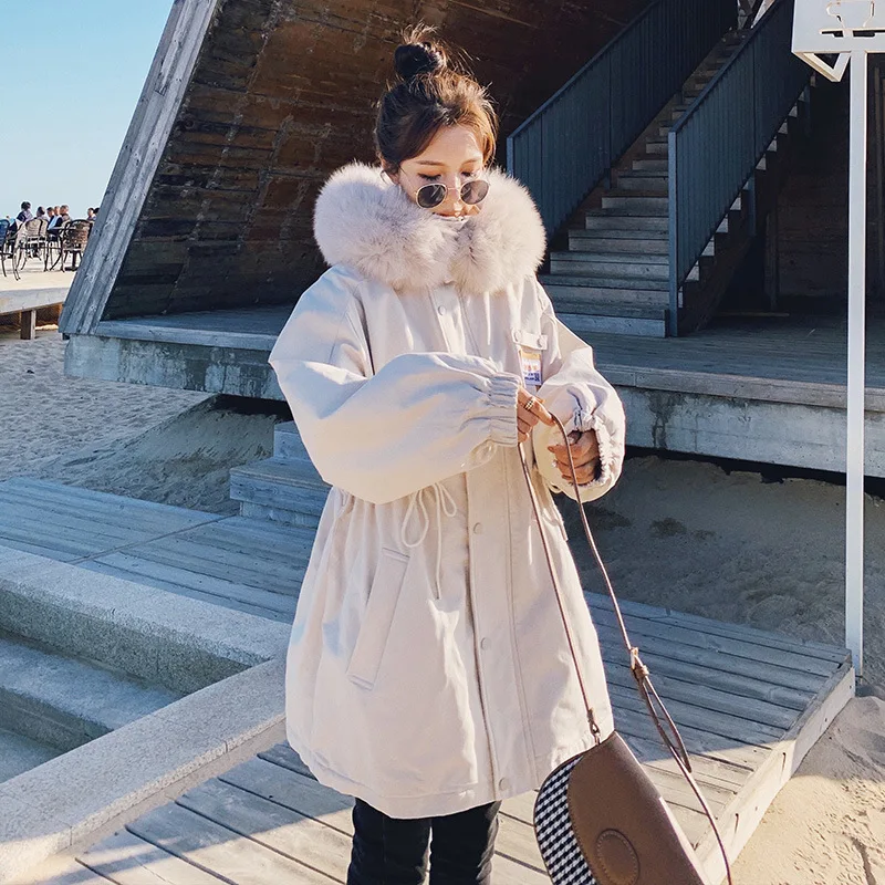Overcome the cotton-padded jacket coat of sending girls' long, padded cotton-padded clothes with velvet.