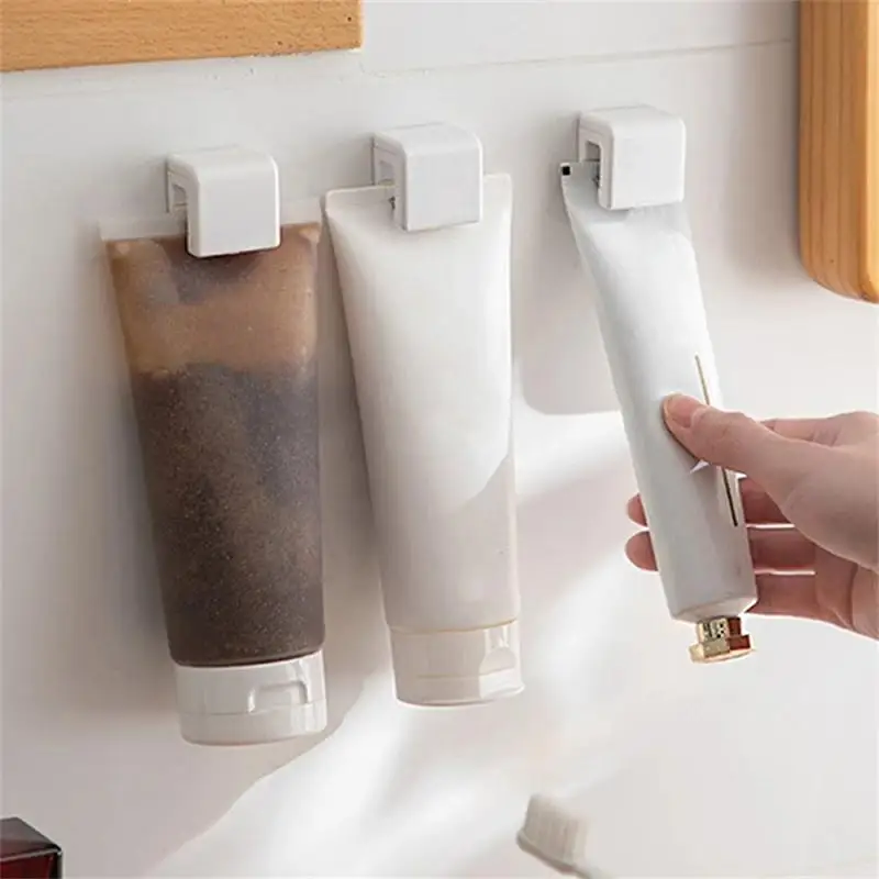

Bathroom Toothpaste Holder Hanger Self-Adhesive Facial Cleanser Clips Multi-purpose Toothpaste Storage Rack Bathroom Accessories