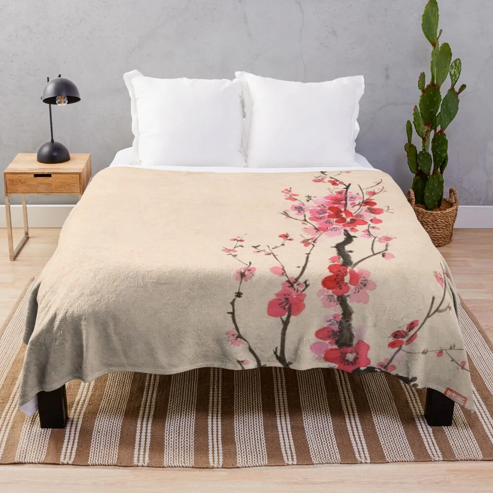 

Japanese sumi-e ink painting of an iconic plum blossom branch with red flowers on beige background art print Throw Blanket