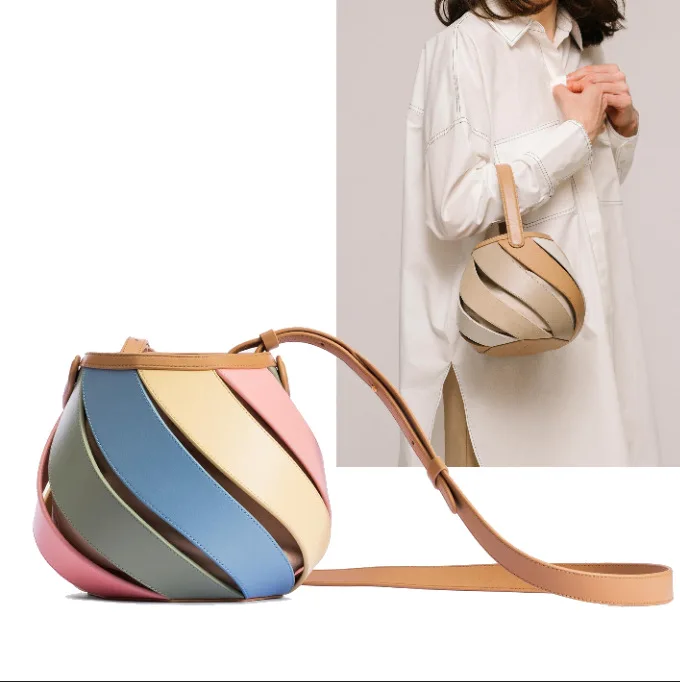 

Cylindrical color contrast hand messenger bag 2023 Little Türkiye one shoulder women's bag ribbed splicing bucket bag