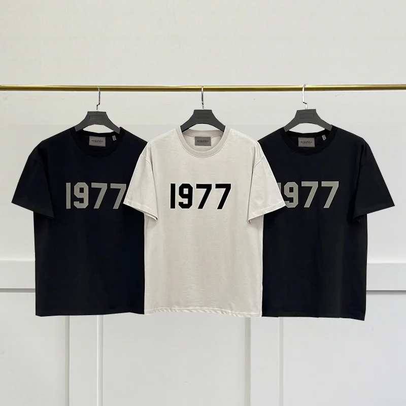 

SS23 New Chest Number 1977 Short Sleeve Unisex Loose High Street Brand ESSENTIALS TRIP Men and Women T-Shirt