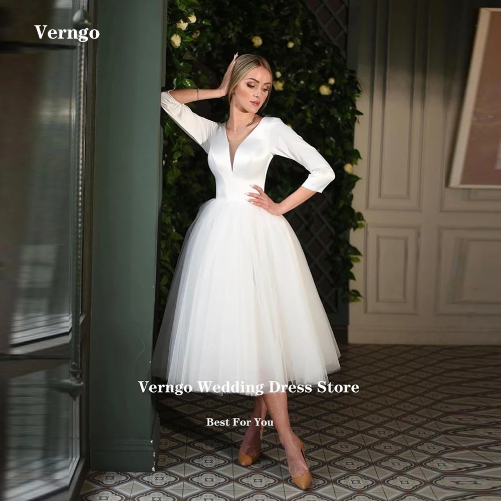 

Платье Свадебное ТРАПЕЦИЕВИДНОЕ атласное ТРАПЕЦИЕВИДНОЕ длиной до середины икры, с длинным рукавом 2/3