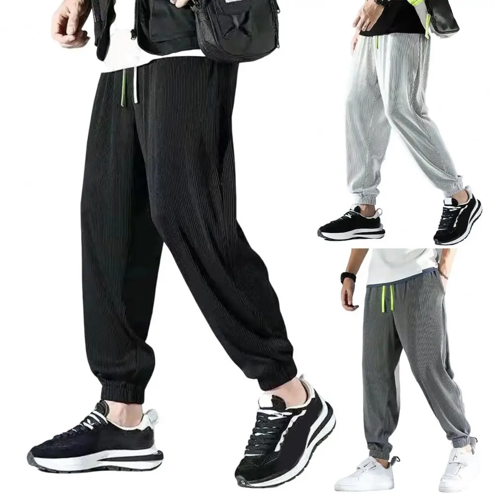 

Men Sweatpants Mid-rise Elastic Waistband Men Trousers Drawstring Pockets Shrinkable Cuffs Loose Trousers Wide Leg Jogging Pants