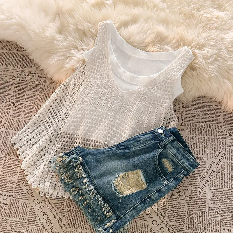 

WDMSNA летний темпераментный Трикотажный костюм-майка с вырезами 2023 новый жилет Трикотажный жилет с дырками кисточками джинсовые шорты Комплект из трех предметов