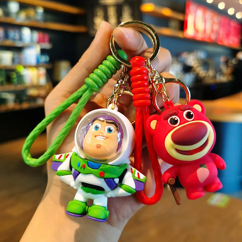 

Woven Silicone Toy Story Keychain Buass Lightyear Strawberry Bear Three-eyed Monster Doll Pendant Exquisite Hanging Ornaments