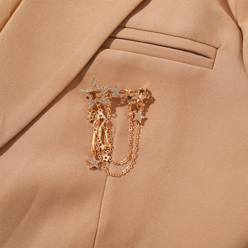 Женская брошь в форме скрипки золотого и серебряного цвета