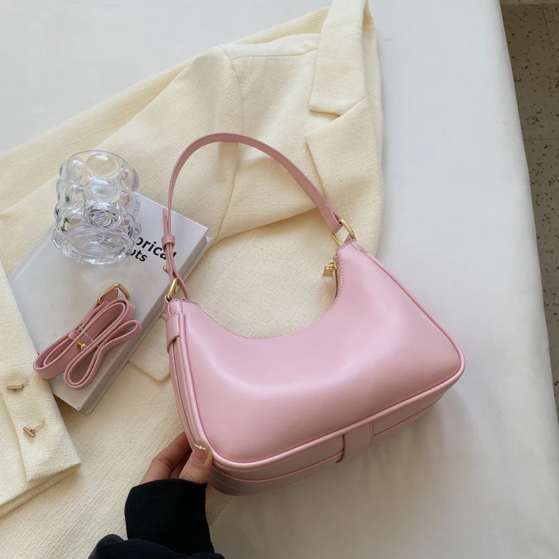 

Linkse Roze Schoudertas Voor Vrouwen Kleine Lederen Schattige Effen Kleur Crossbodytassen 2023 Lente Designer Oksel Handtas