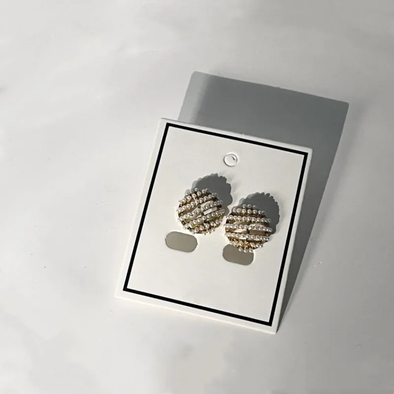 

2023 New Women's Pearl Earrings Hollow Metal Alloy Ball Ear Stud Earrings for Women Bijoux Korean Girl Gifts Jewelry Wholesale