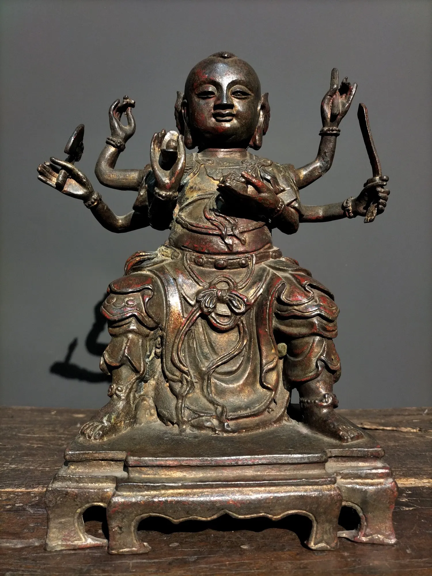 

13"Tibetan Temple Collection Old Bronze Nezha red boy Three heads and six arms Sitting Buddha Town house Exorcism