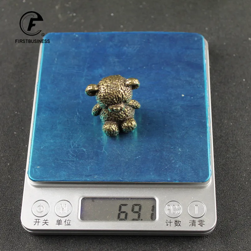 

Миниатюрная статуэтка медведя из латуни