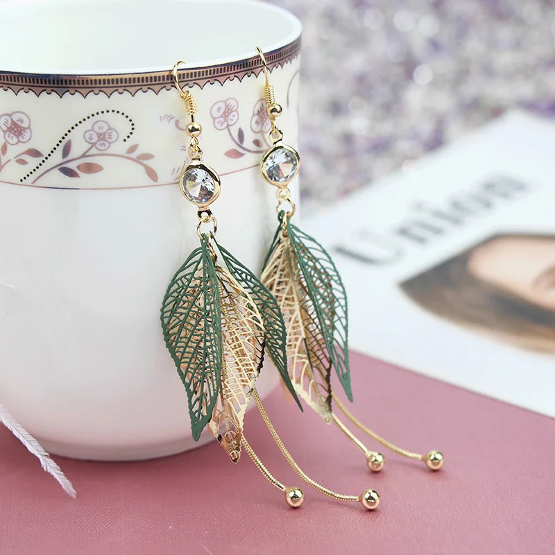 

New net red hollowed out Leaf Earrings Fashion temperament personality long Zircon Earrings show face thin and fresh Earrings