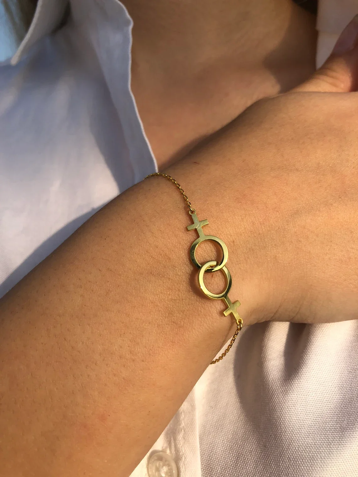 Женский браслет из нержавеющей стали с символом двойной венерины