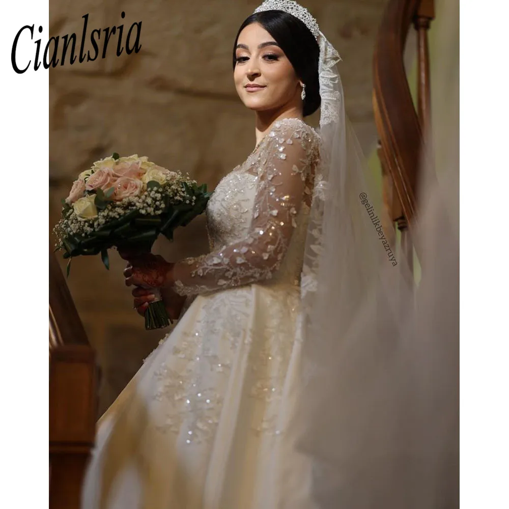 

Luxury Lace Dubai Wedding Dresses Long Sleeves Sequins Beads Sheer Neck Appliques Glitter Tulle Bride Gowns Vestido de Noiva
