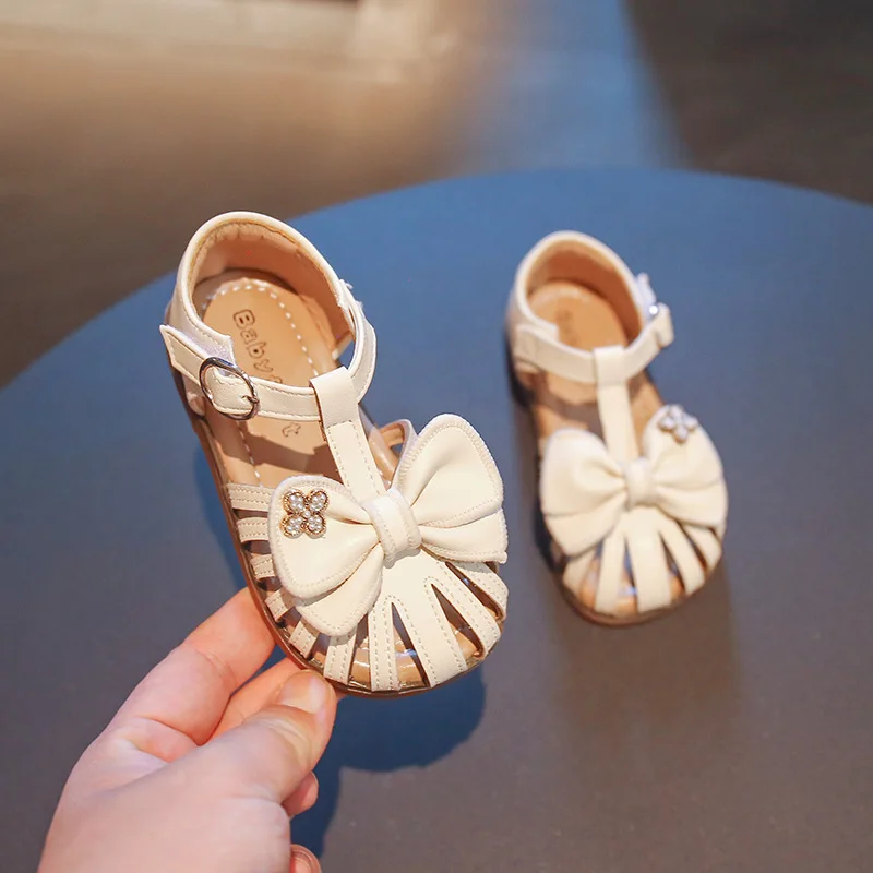 

Сандалии для девочек, Новинка лета 2022, обувь принцессы для девочек с бантом, сандалии на плоской подошве, детские мягкие однотонные модные Н...