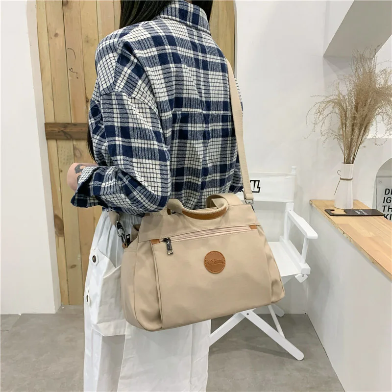 

Fashion Leisure Women's Bag 2023 New High Capacity Zipper Handheld Single Shoulder Crossbody Bag Commuter Multi Compartment Bag