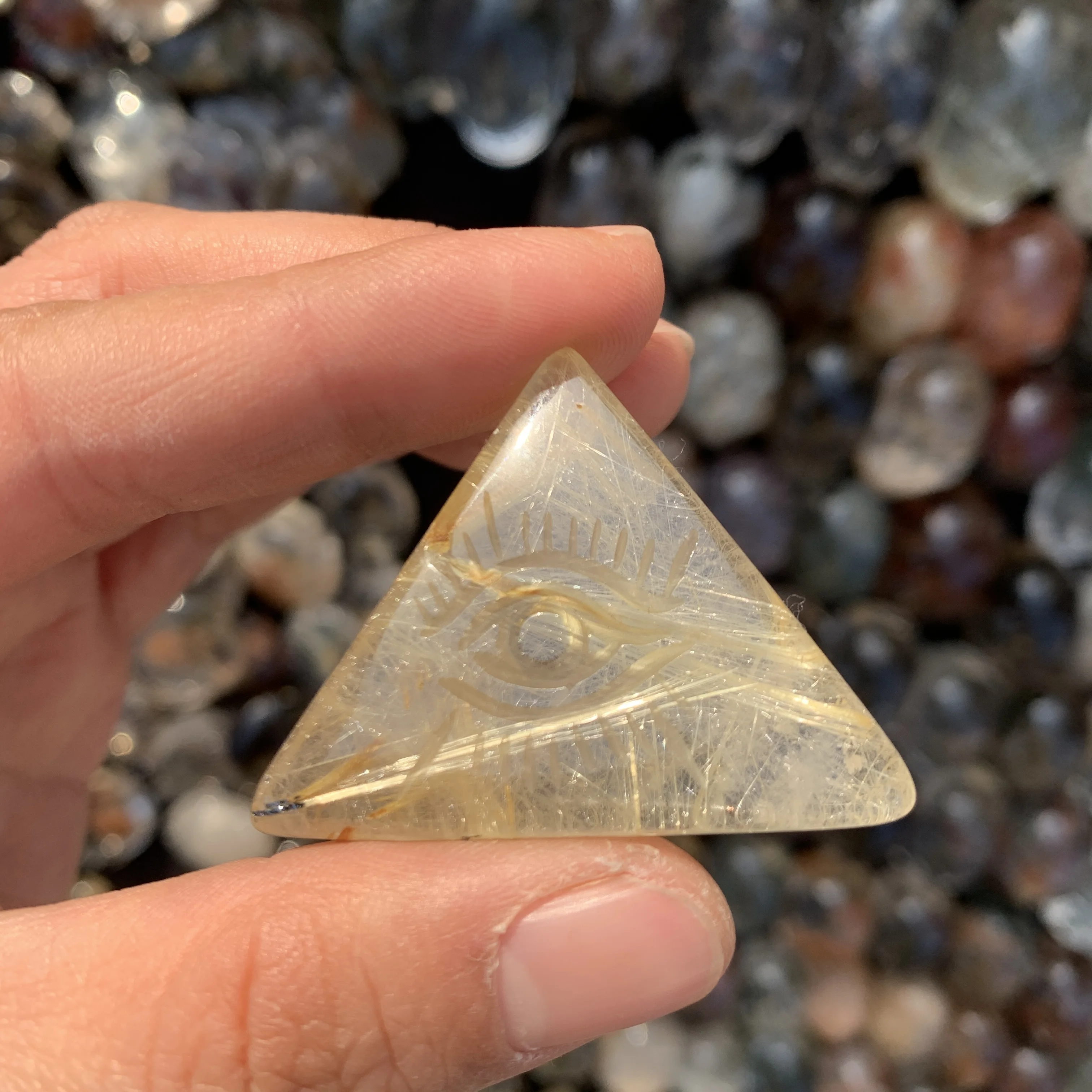 

Natural Rutilated quartz crystal carved Evil Eye