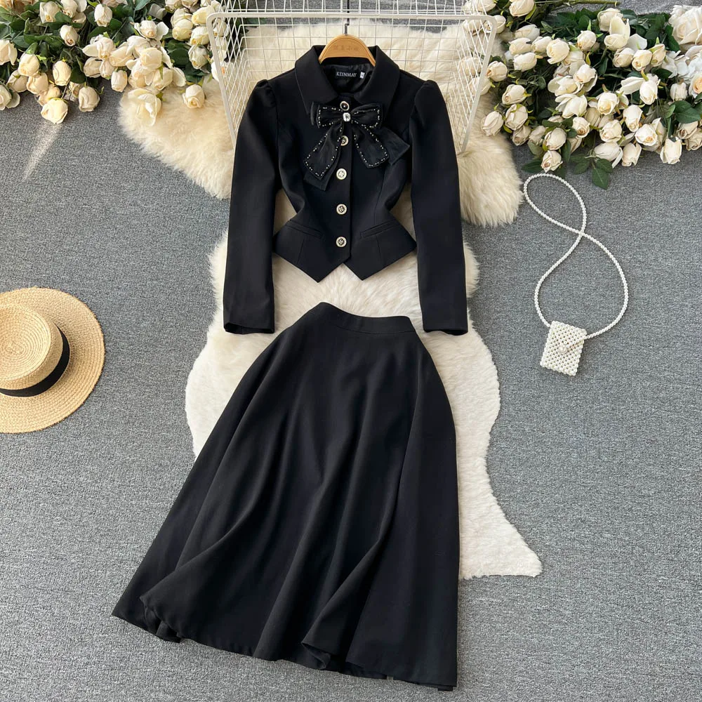 

Autumn College Wind Bow Irregular Short Blazer + Mid-length Half-body Skirt Two-piece Set