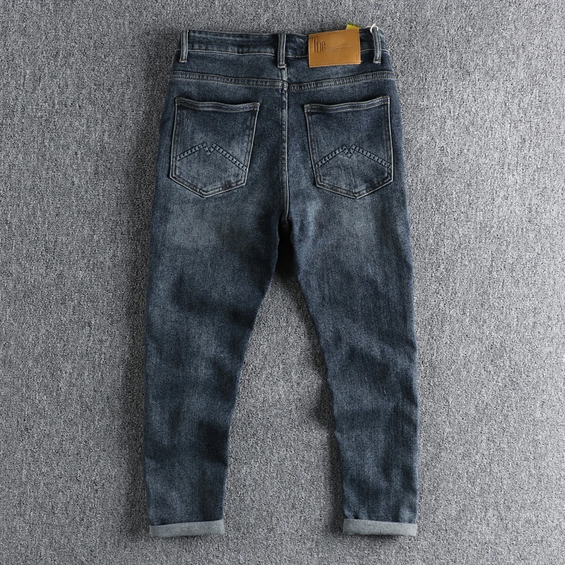 Retro washing blue hole patch jeans men's slim little straight feet trend Europe and America Joker youth long pants