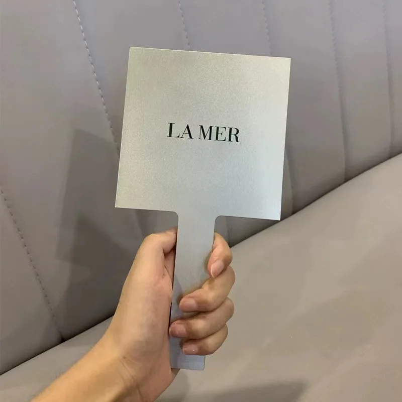 

LAMER handheld mirror, portable sand silver souvenir cosmetic mirror, metallic gift boxed handle mirror